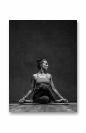 Young beautiful yoga female posing in studio