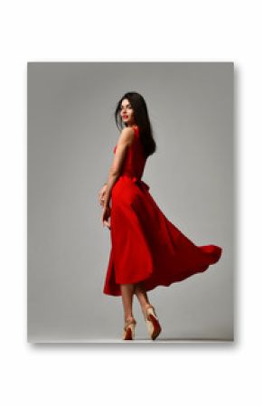 Pretty brunette woman in formal red dress stiletto heels shoes