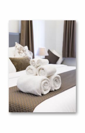 White towel roll on hotel resort bed