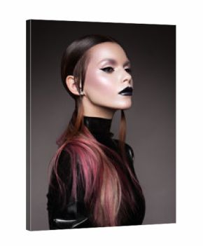 Portrait of beautiful Gothic woman in dark dress in studio