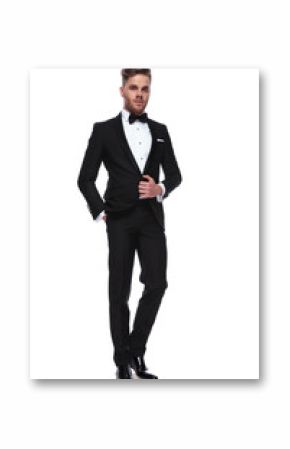 full body picture of a young elegant man in tuxedo