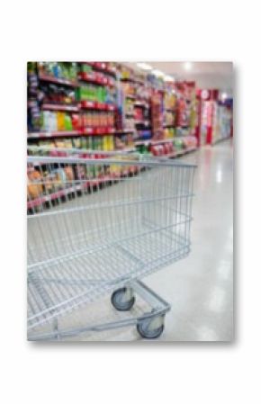 Cropped image of shopping cart in supermarket aisle