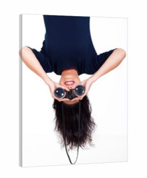 upside down woman holding binoculars