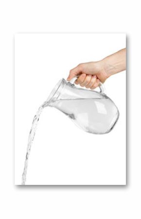 Pouring water from glass pitcher, isolated on white