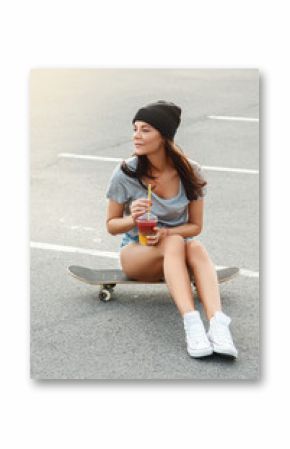 Sexy girl sitting on the skateboard