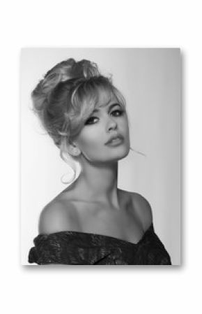 portrait of a beautiful blonde woman in retro dress 50-s style . monochrome black and white photo