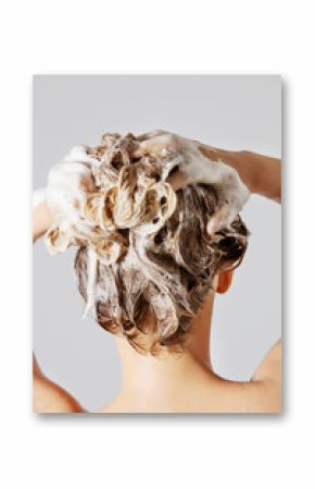 Woman washing her blond hair