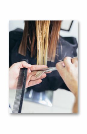 Close-up of a woman in hair salon getting her hair cut by the hairdresser.