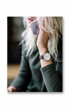 white women's wrist watch on the girl's hand