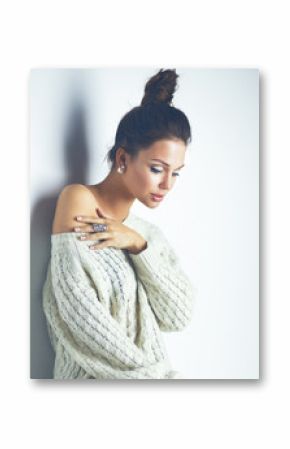 Portrait of a cute woman in sweater at home