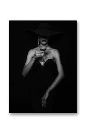 Luxury woman in a black hat with Martini glass in hand.