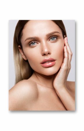 Beauty portrait of model with natural make-up. Fashion shiny highlighter on skin, sexy gloss lips make-up