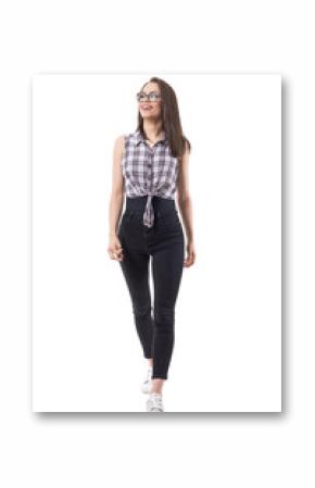 Smiling young cheerful cool modern woman walking towards camera and looking up. Full body isolated on white background. 