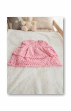 High angle view of stuffed toy by clothing on bed