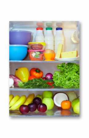 refrigerator full of healthy fruits, vegetables and dairy