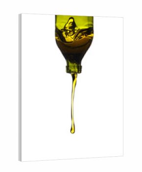 Olive oil pouring from green bottle, isolated against white background.