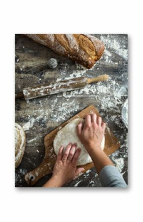 woman kneading bread dough with her hands