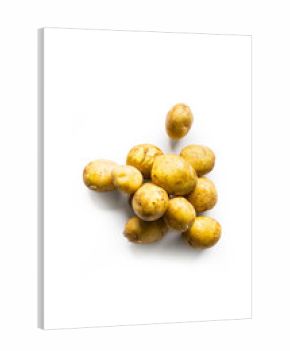 beautiful small rounded whole organic potatoes with the peel isolated on a white background seen from above
