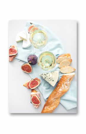 wine and snacks on grey table