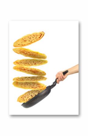 Frying pan with flying pancakes in women hand isolated