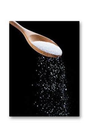 Salt shaker,Sea salt on wooden spoon on black background