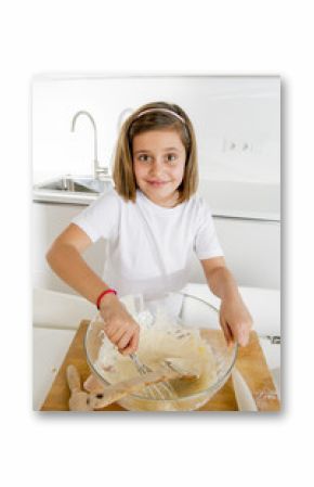 mini chef girl mixing flour and eggs baking preparing sweet desert smiling happy