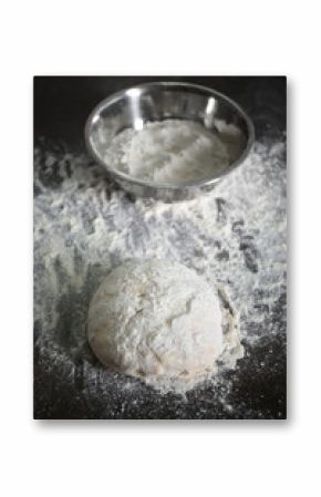 Fresh dough and metal bowl on kitchen table