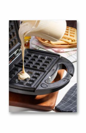 Baking homemade Belgian waffles in the waffle maker.