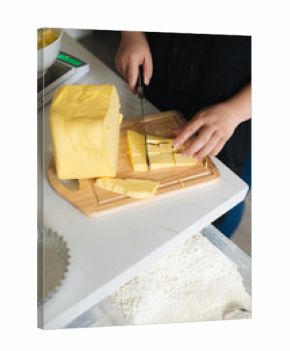 Bakery chef mixing butter in the kitchen professional