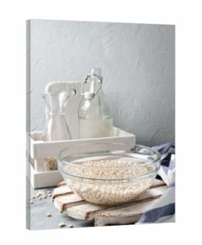 White beans soaked in water in a glass bowl