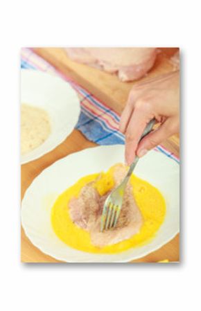 Preparing meal of breaded chicken cutlets