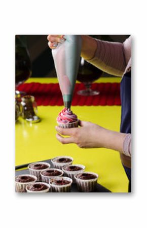 Woman decorating cupcakes