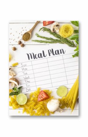 A meal plan for a week on a white table among products for cooking - pastas, basil, vegetables, lime, seeds, nuts and spices. Top view, flat lay, copyspace