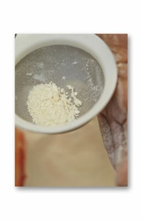 Shifting flour with sieve 