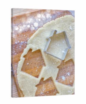 Festive Christmas cookies. Background from sand cookies in the shape of a house. Close up