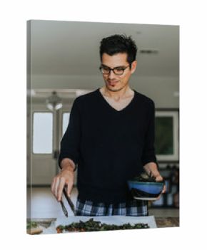 Man making fried kale and chickpeas for dinner