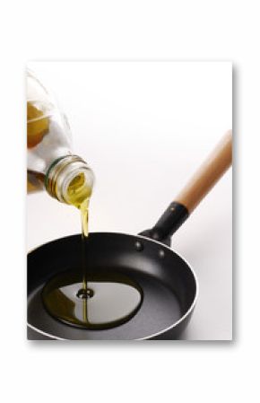 Pouring oil on a pan.