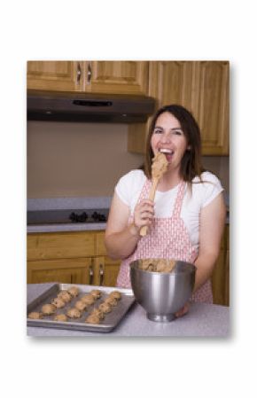 Woman eating cookie dough