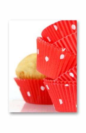 Muffin cups and muffin on white background