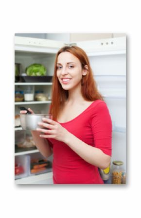 Happy long-haired woman with pan