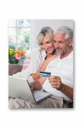 Mature couple doing online shopping at home