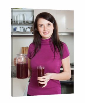 woman with jug of red fruit-drink or juice