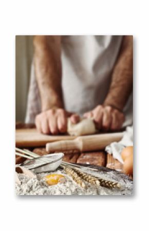 Handful of flour with egg yolks in a bakery