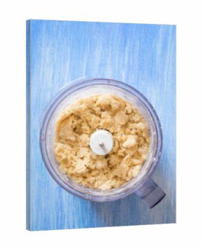 Shortcrust pastry in food processor bowl. Selective focus.