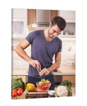 Young man preparing food at home