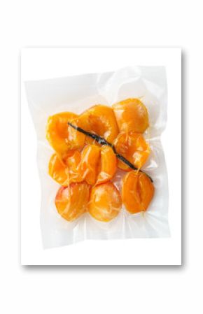 Vacuum sealed fresh apricots with vanilla for sous vide cooking cutout on white