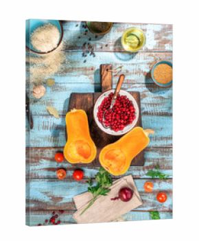 Raw ingredients for preparation baked squash on wooden table