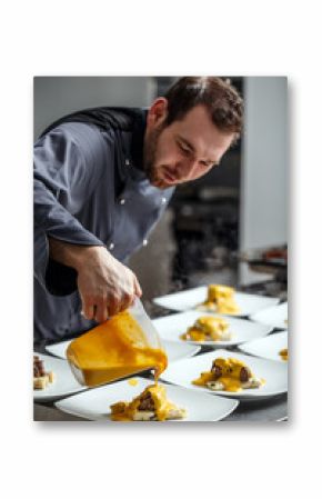 Chef pouring sauce