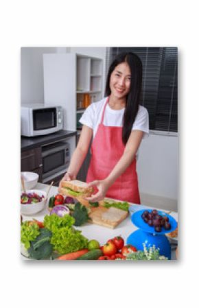 woman preparing a sandwich in kitchen room