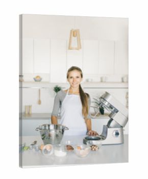 the girl is cooking in the kitchen